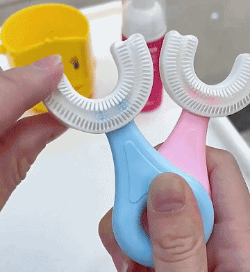 Child using U-shaped toothbrush